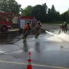 DFD members having fun practicing nozzle techniques.
